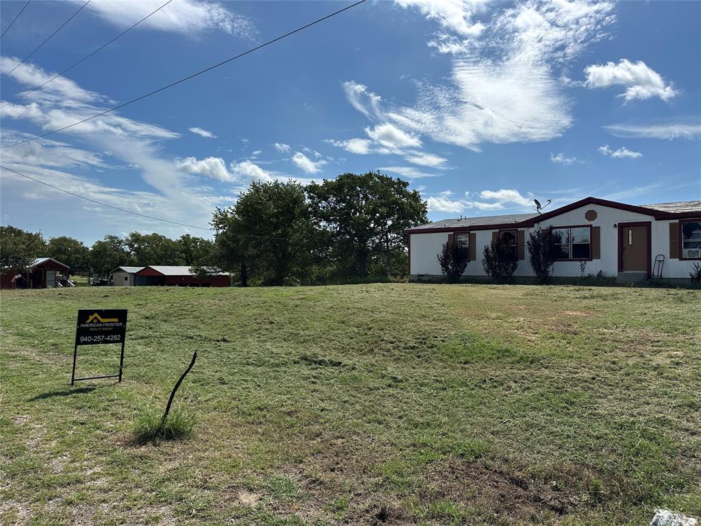 570 Big Salty Lane Springtown, TX 76082 - Photo 13 of 36 Single-story residence featuring white siding and brown trim