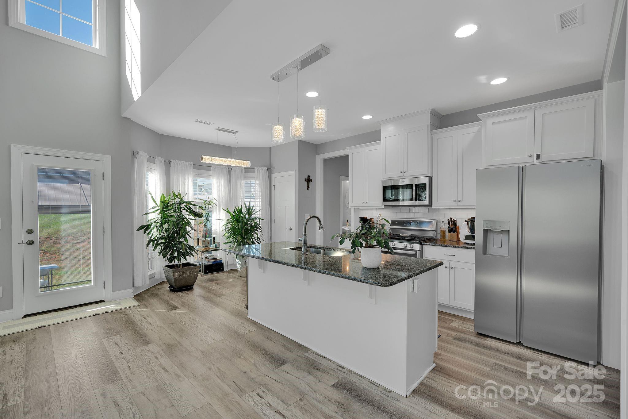 236 Pinnacle Crossing Shelby, NC 28152 - Photo 13 of 39 a kitchen with a refrigerator and a view of living room