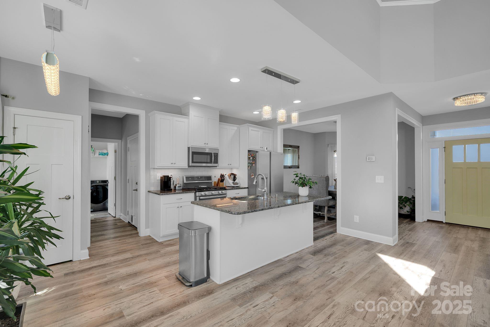 236 Pinnacle Crossing Shelby, NC 28152 - Photo 14 of 39 a kitchen with stainless steel appliances kitchen island sink stove and cabinets