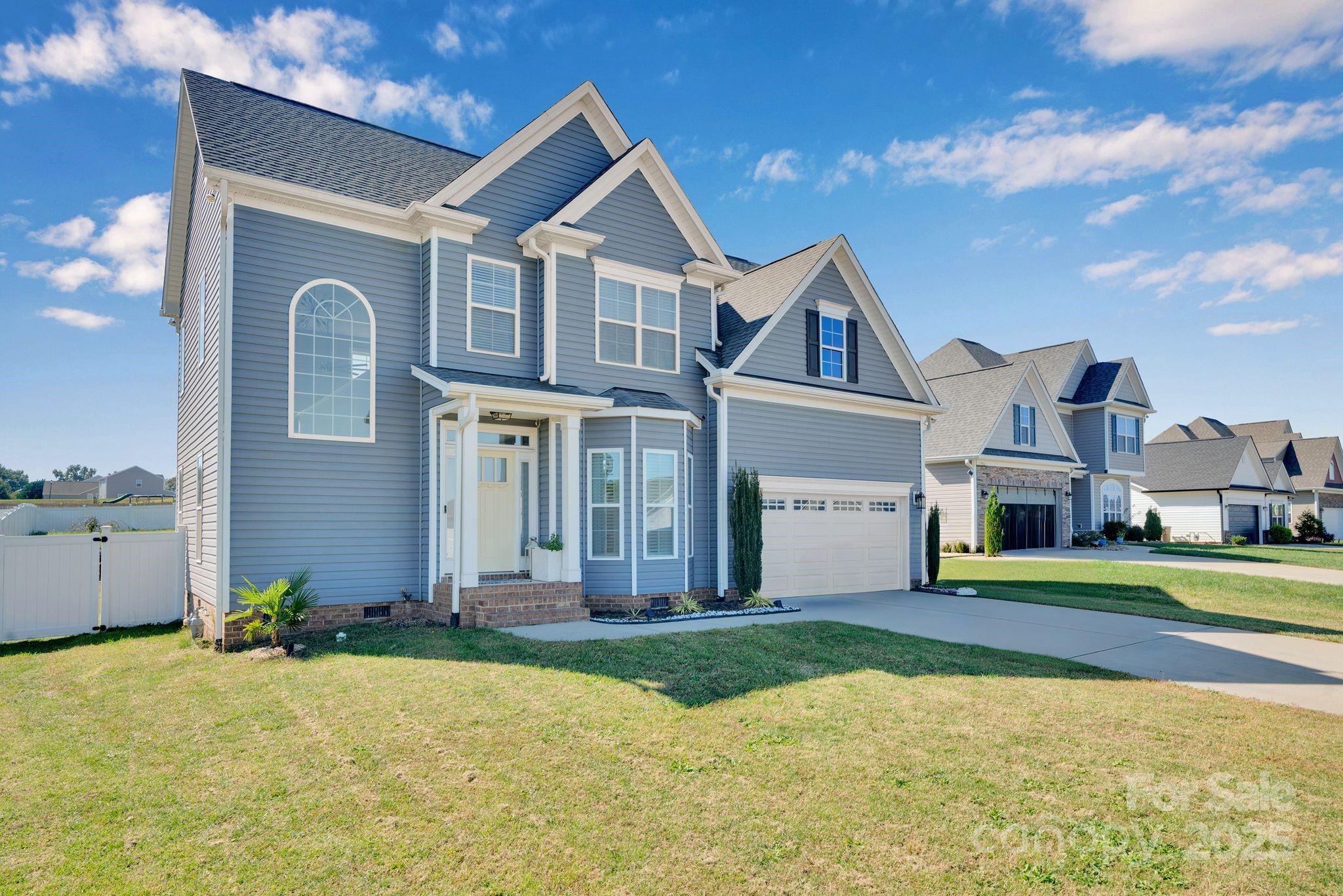 236 Pinnacle Crossing Shelby, NC 28152 - Photo 2 of 39 a front view of a house with a yard