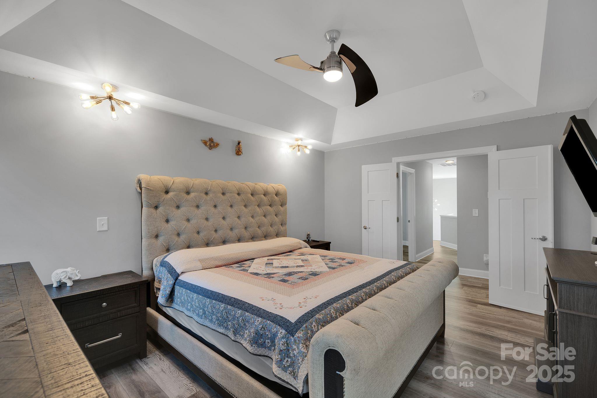 236 Pinnacle Crossing Shelby, NC 28152 - Photo 27 of 39 a bedroom with a bed and a chandelier