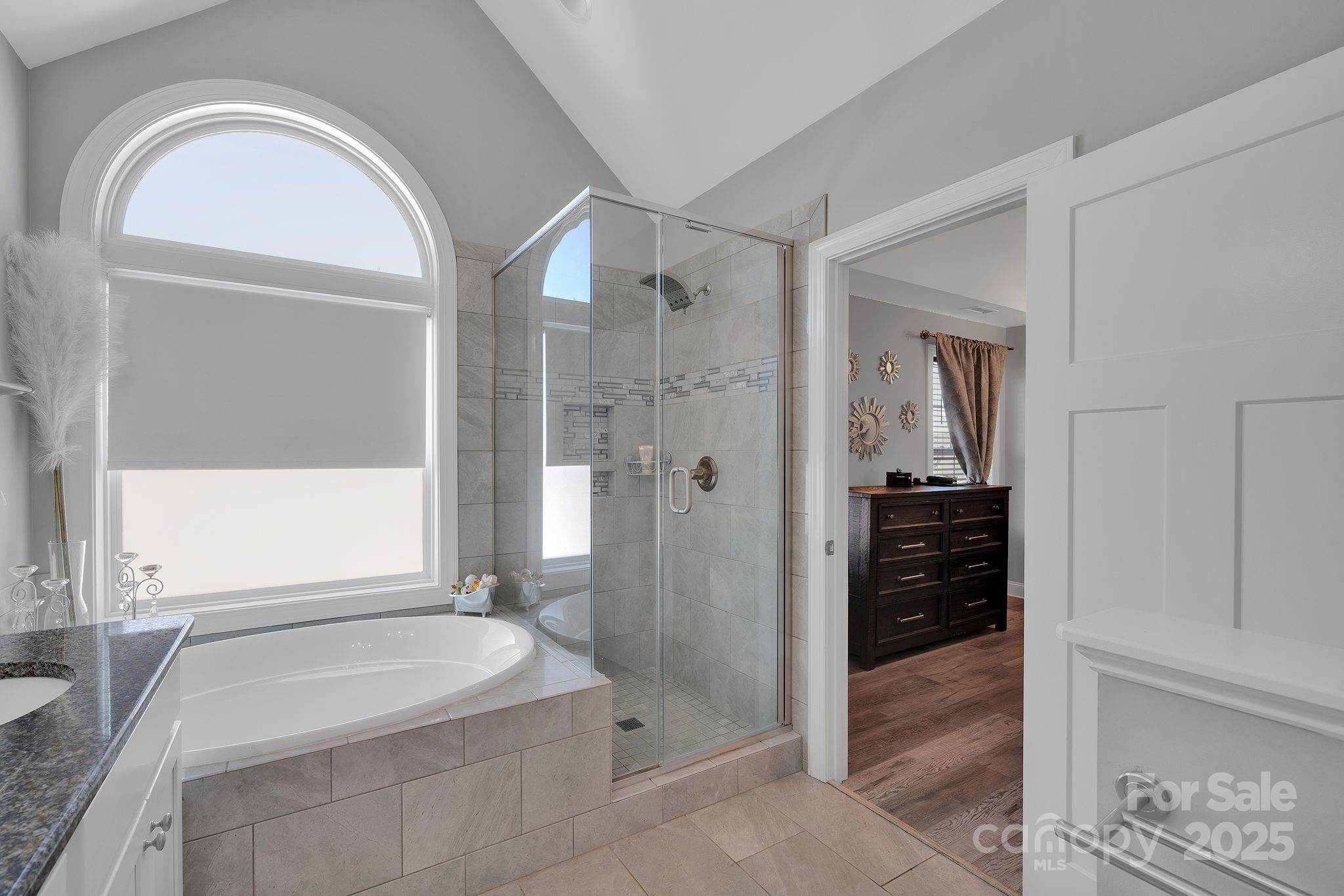 236 Pinnacle Crossing Shelby, NC 28152 - Photo 29 of 39 a spacious bathroom with a granite countertop sink mirror and shower