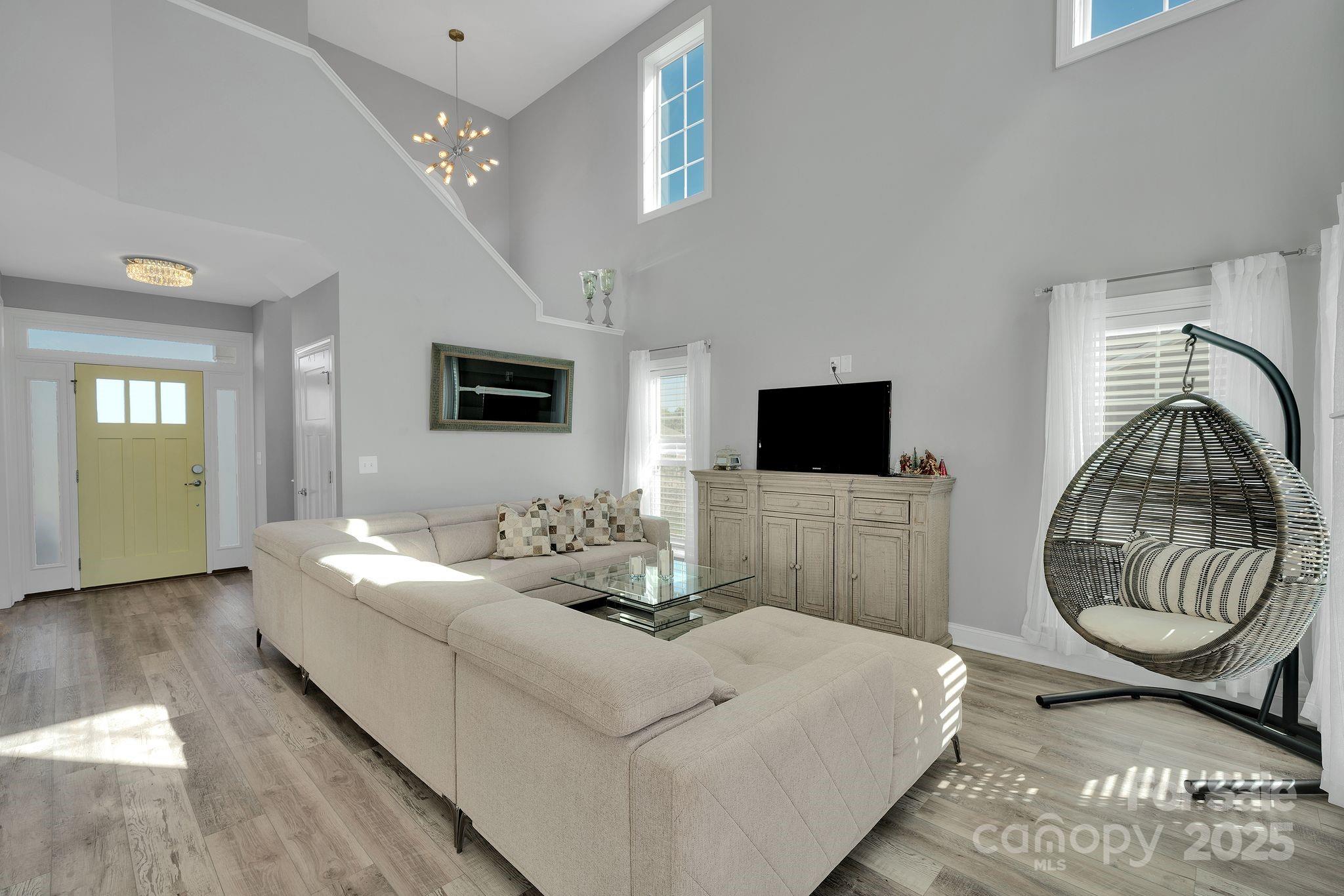 236 Pinnacle Crossing Shelby, NC 28152 - Photo 4 of 39 a living room with a bed and a flat screen tv