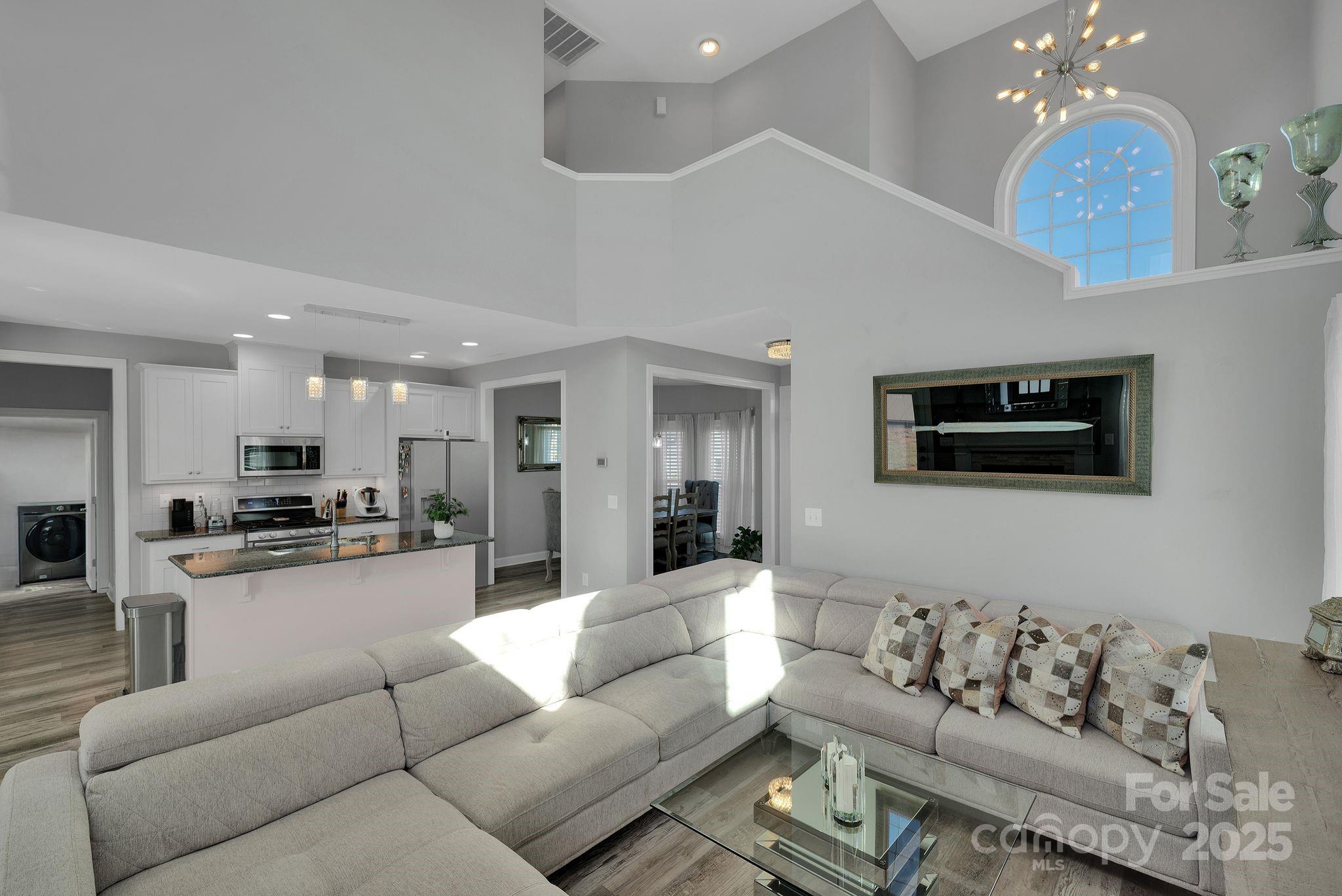 236 Pinnacle Crossing Shelby, NC 28152 - Photo 7 of 39 a living room with furniture kitchen view and a wooden floor