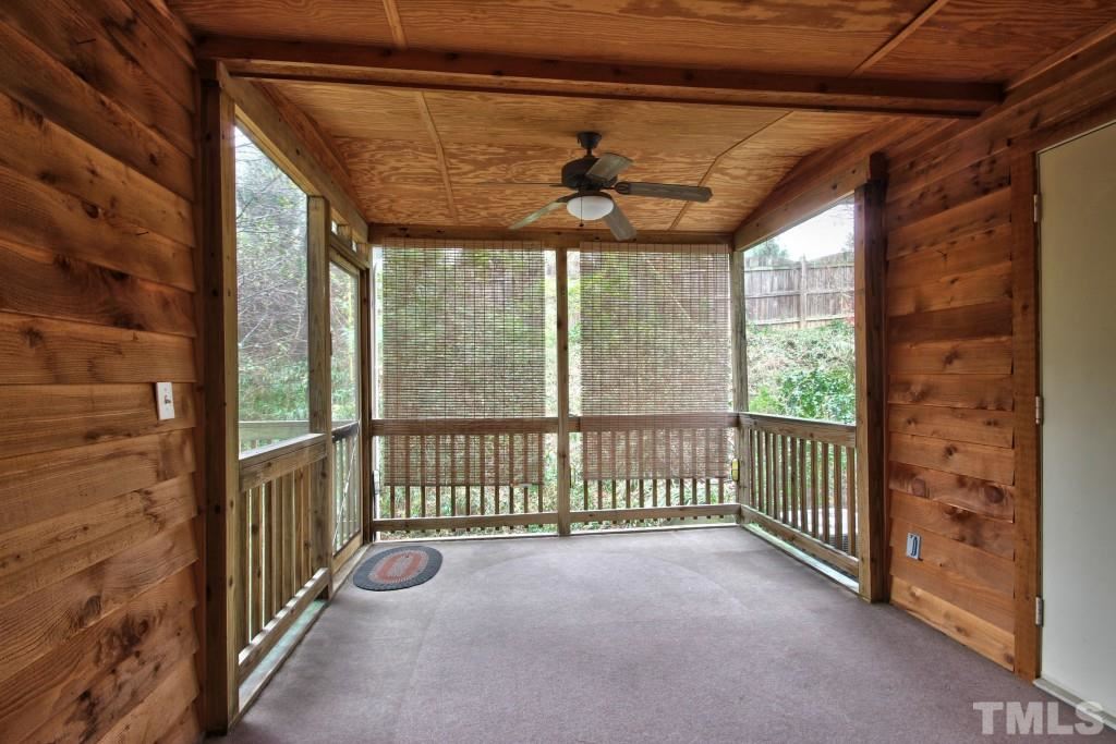 1434 Quarter Point Raleigh, NC 27615 - Photo 10 of 22 Screened in porch with attached deck and storage area