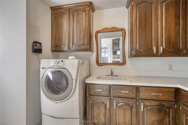 a bathroom with a sink a mirror and a shower