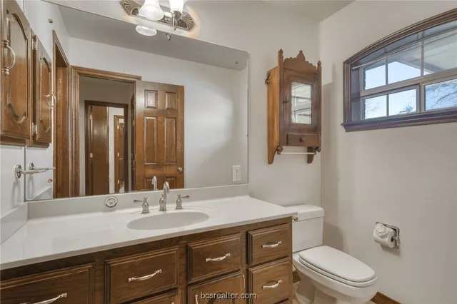 an empty room with a ceiling fan and a window