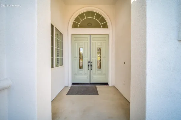 a large kitchen with a table and chairs