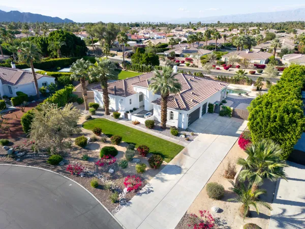 an aerial view of a house with a garden