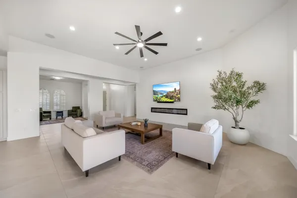 a bathroom with a granite countertop sink mirror and toilet