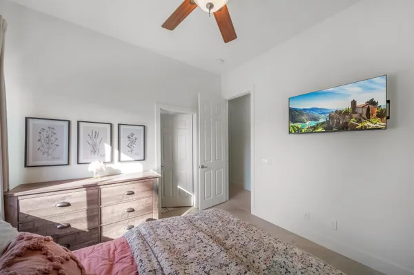 a spacious bedroom with a bed and window