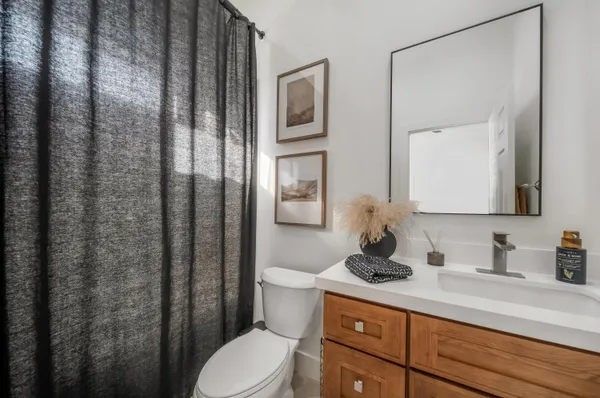 a spacious bedroom with a large bed and a large window