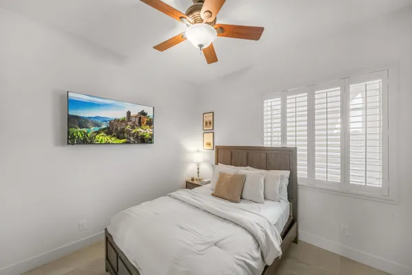 a bathroom with a toilet a sink and a mirror