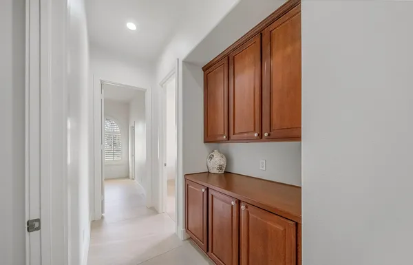 a bathroom with a granite countertop sink mirror and shower
