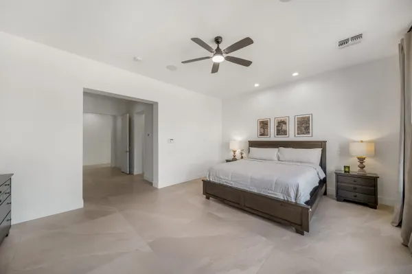 a view of a house with swimming pool and a yard