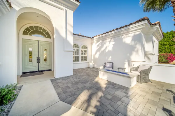 a view of a terrace with couches and sky view