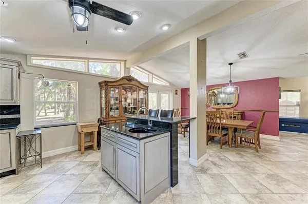 a kitchen with a stove and a refrigerator