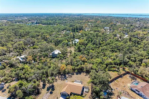 a view of a house with a tree in the background