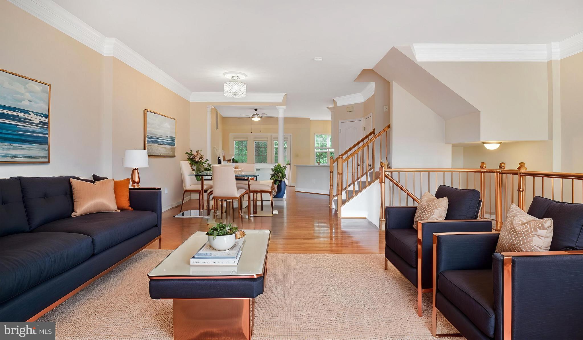 2080 Capstone Circle Herndon, VA 20170 - Photo 11 of 38 a living room with furniture and wooden floor
