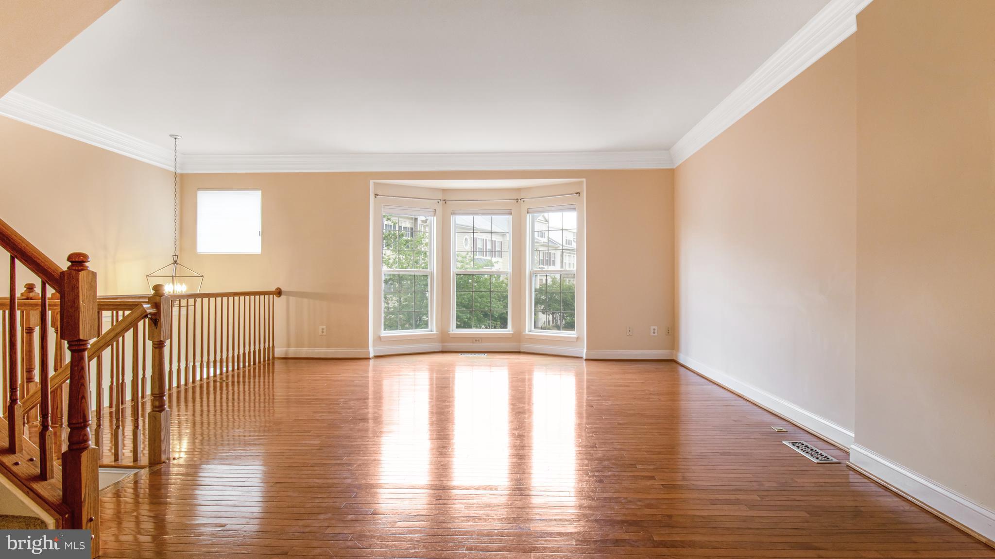 2080 Capstone Circle Herndon, VA 20170 - Photo 12 of 38 a view of an empty room with wooden floor and a window
