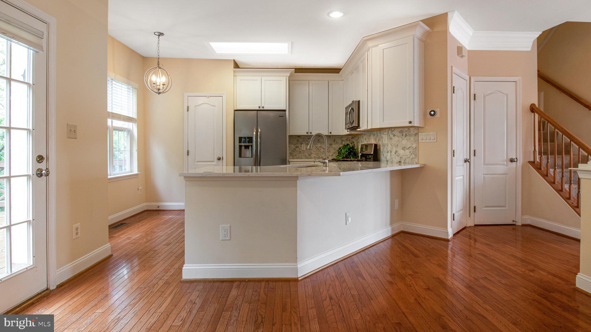 2080 Capstone Circle Herndon, VA 20170 - Photo 16 of 38 a kitchen with stainless steel appliances a refrigerator and a stove top oven