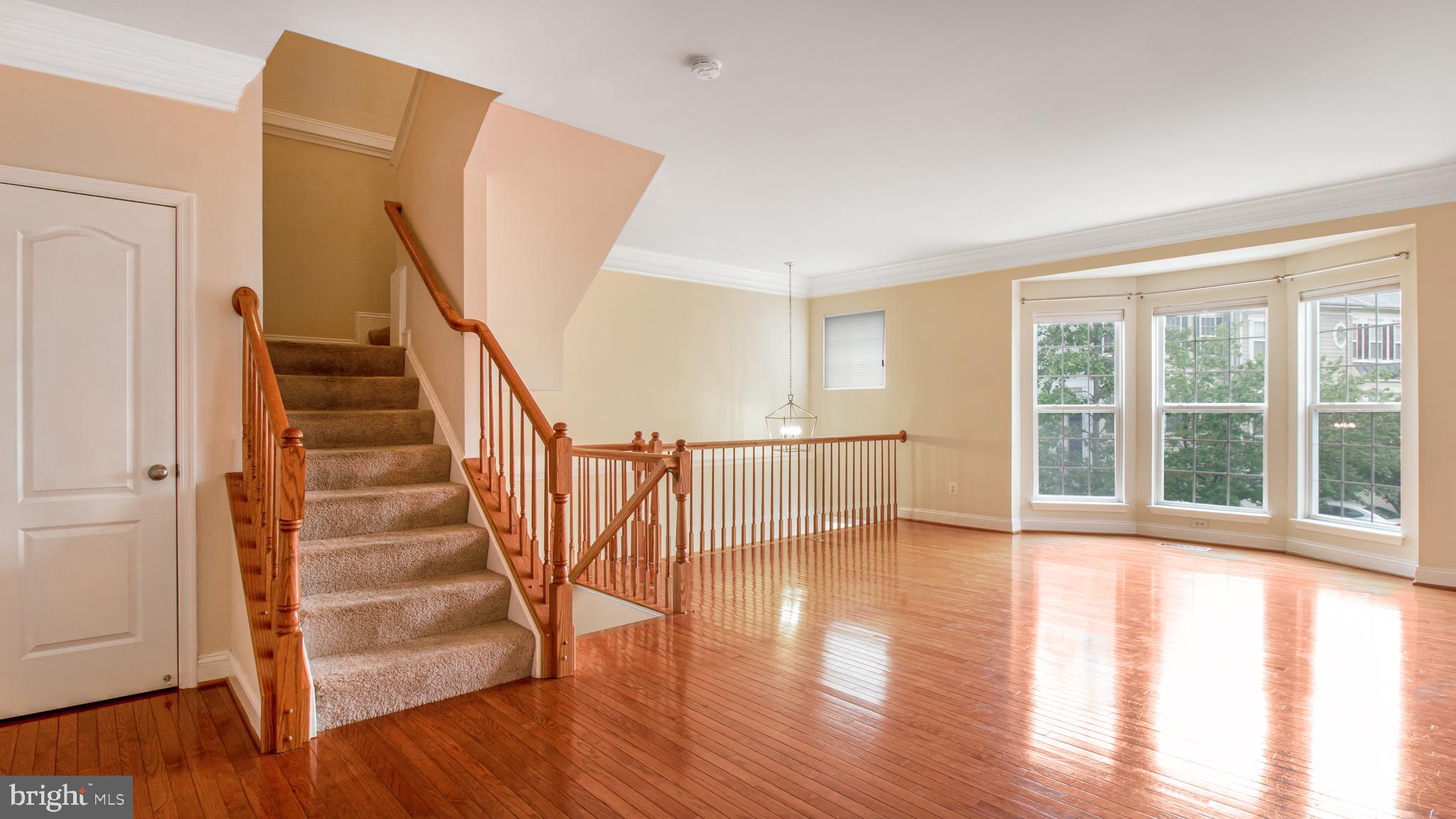2080 Capstone Circle Herndon, VA 20170 - Photo 21 of 38 a view of an entryway with wooden floor and door