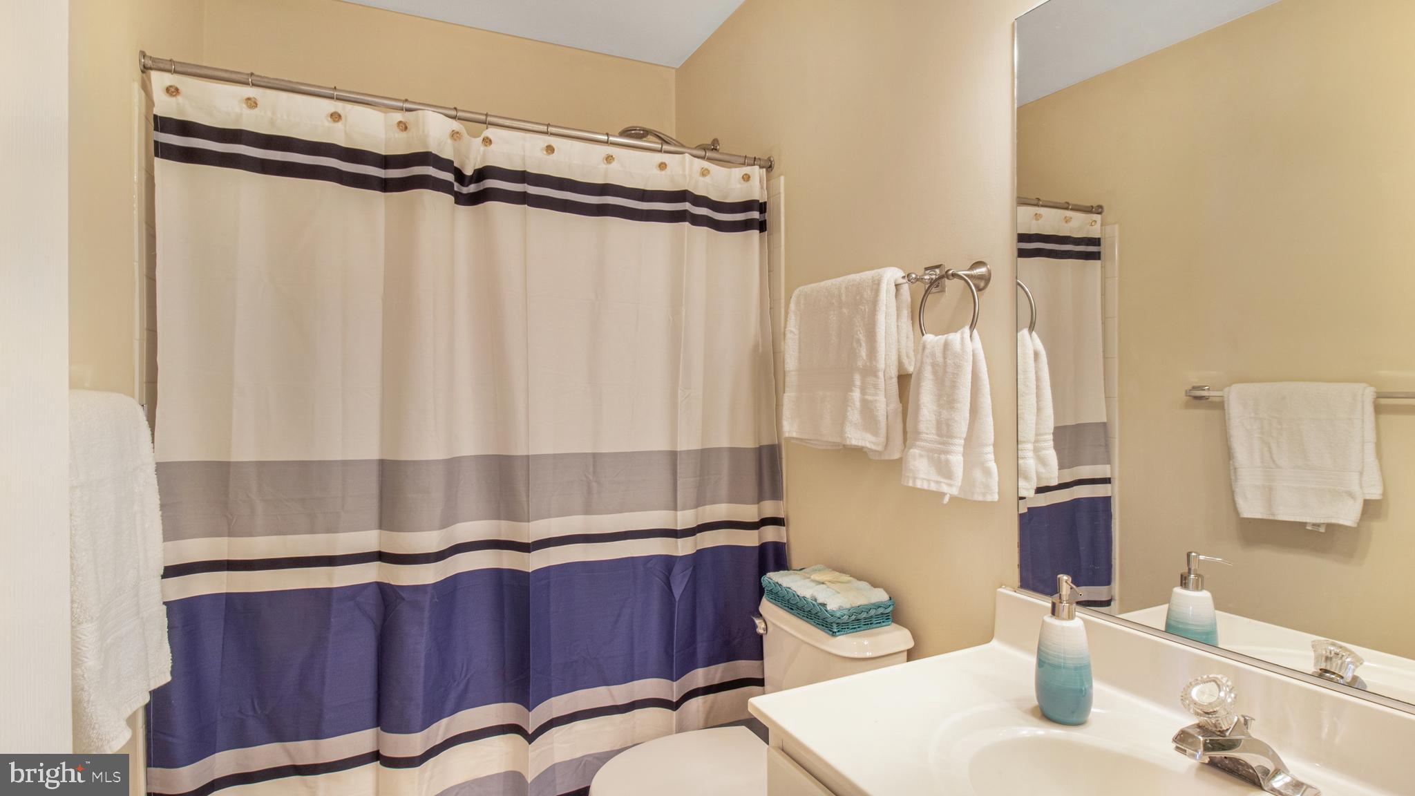 2080 Capstone Circle Herndon, VA 20170 - Photo 29 of 38 a bathroom with a granite countertop sink and a mirror
