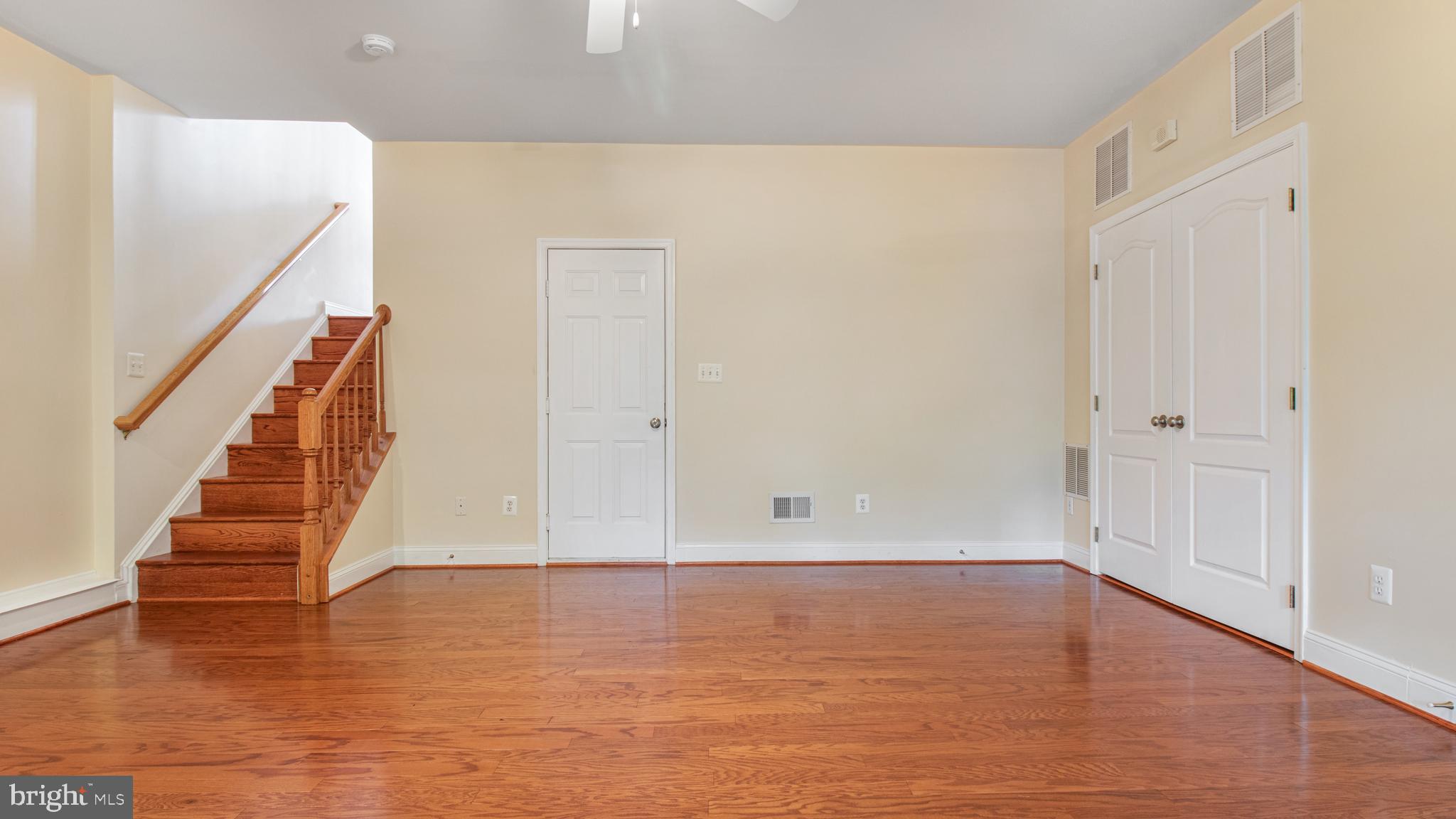 2080 Capstone Circle Herndon, VA 20170 - Photo 3 of 38 a view of room with wooden floor and staircase