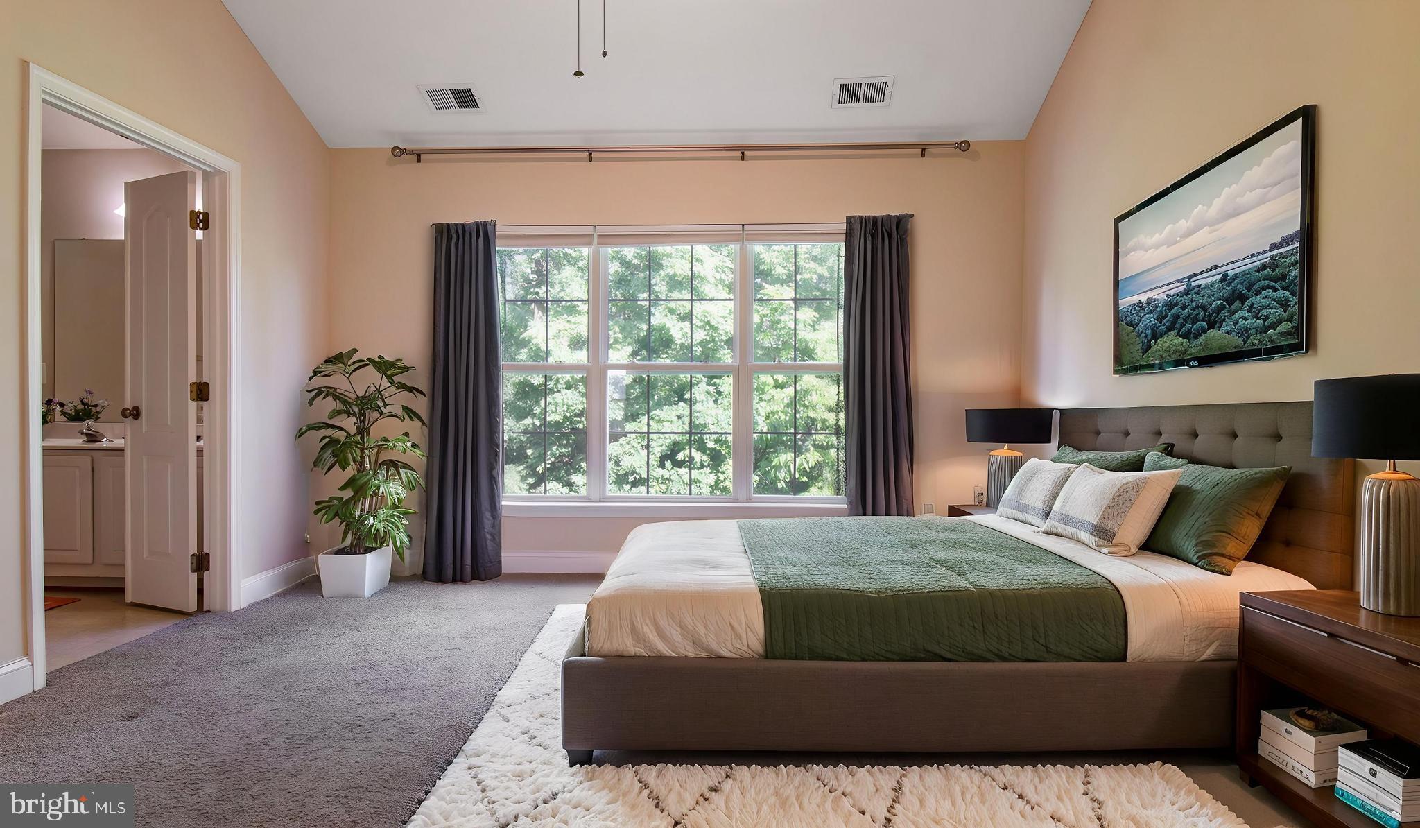 2080 Capstone Circle Herndon, VA 20170 - Photo 32 of 38 a bed sitting in a spacious bedroom next to a window