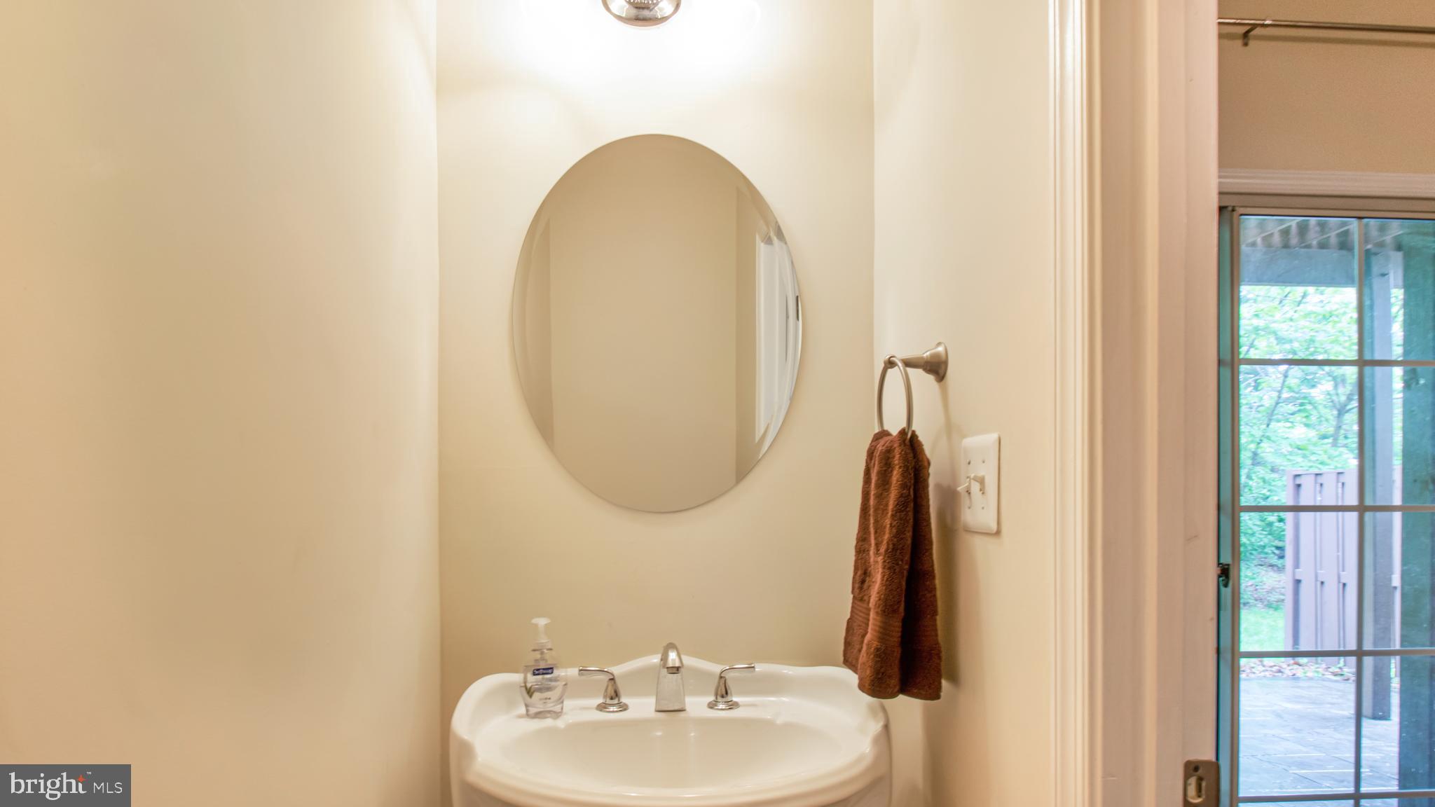 2080 Capstone Circle Herndon, VA 20170 - Photo 4 of 38 a bathroom with a sink and a mirror
