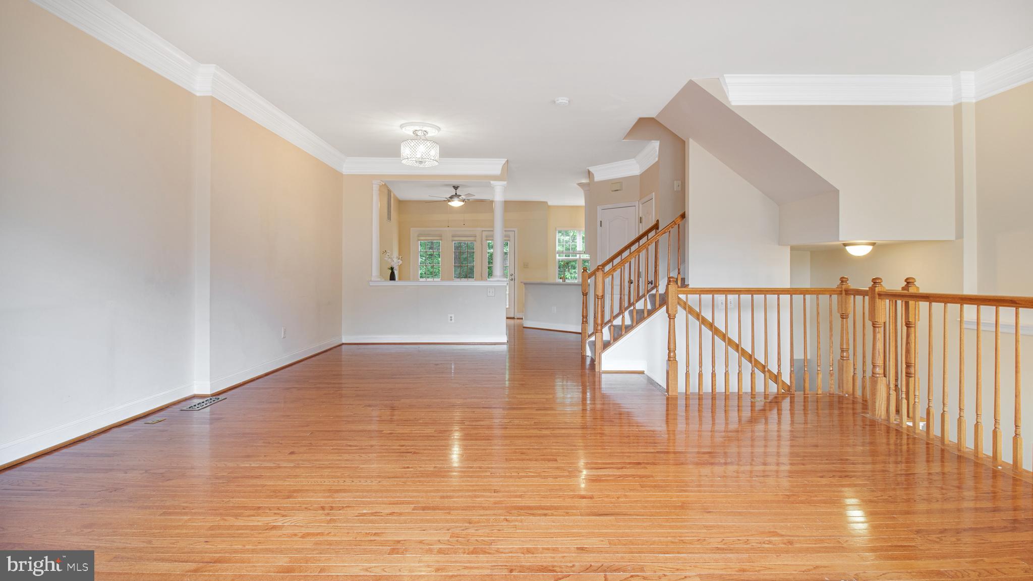 2080 Capstone Circle Herndon, VA 20170 - Photo 9 of 38 a view of entryway and hall with wooden floor