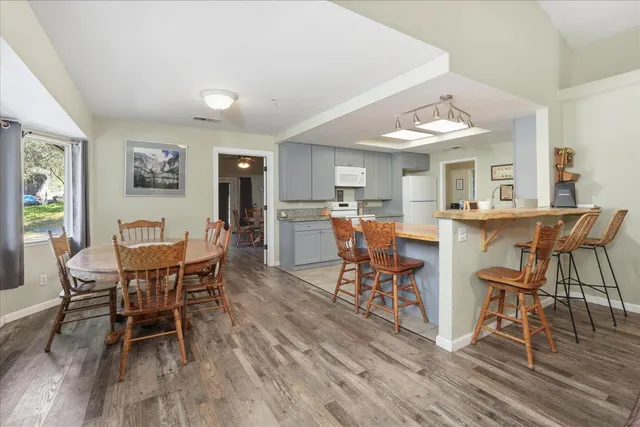 a view of a dining room with furniture window and wooden floor