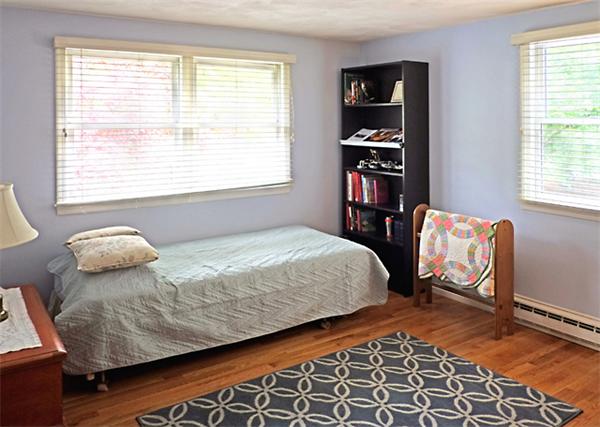 53 Squire Road Winchester, MA 01890 - Photo 6 of 11 a bedroom with a bed and wooden floor