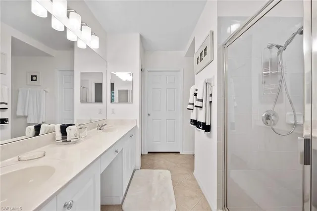 a view of a dining room with furniture a chandelier and wooden floor