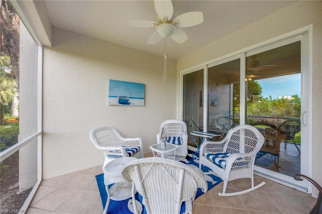 4685 Hawks Nest Way, Unit 103 Naples, FL 34114 - Photo 24 of 35 a view of a dining room with furniture window and outside view