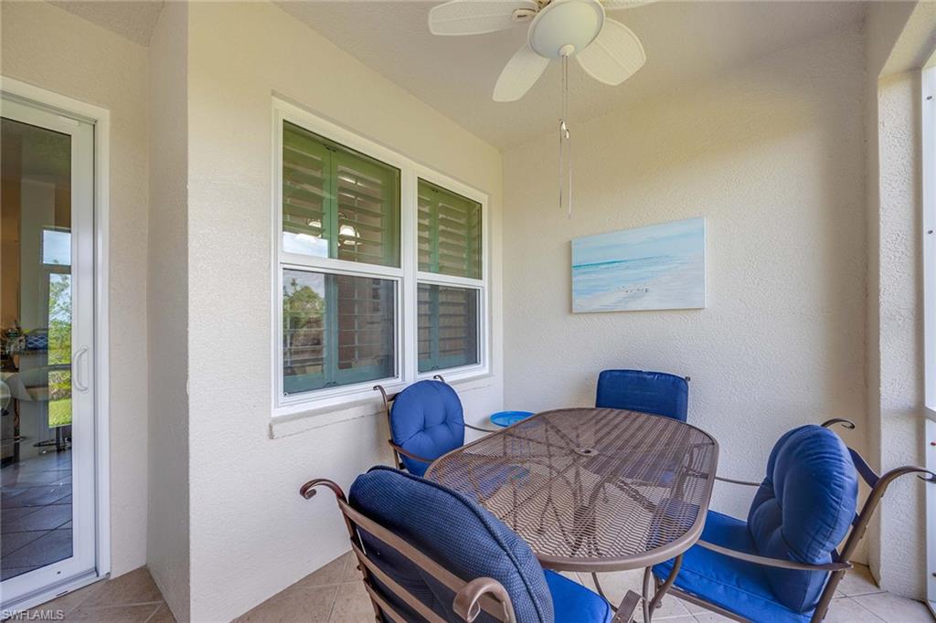 4685 Hawks Nest Way, Unit 103 Naples, FL 34114 - Photo 25 of 35 a living room with furniture and a window