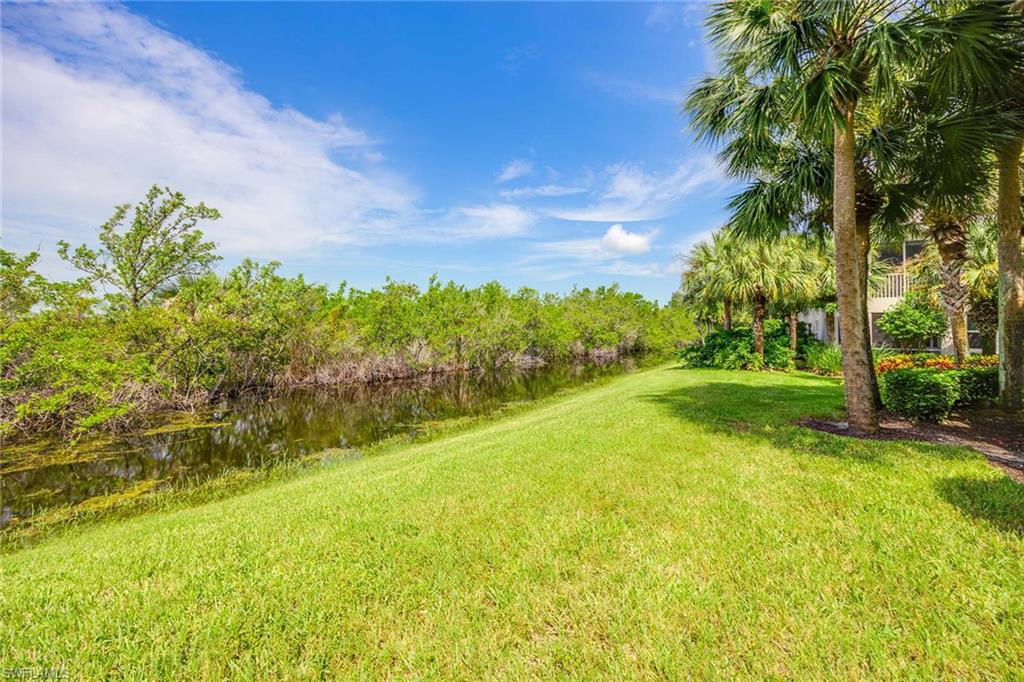 4685 Hawks Nest Way, Unit 103 Naples, FL 34114 - Photo 26 of 35 a view of a yard with an trees