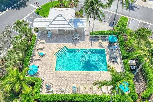 an aerial view of a multi story residential apartment building with yard