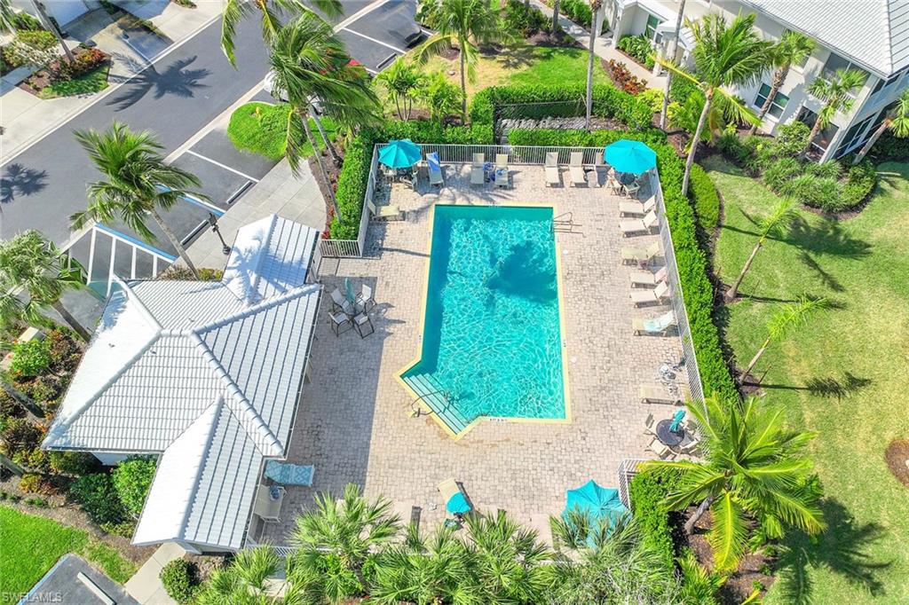 4685 Hawks Nest Way, Unit 103 Naples, FL 34114 - Photo 30 of 35 a view of backyard with swimming pool and outdoor seating