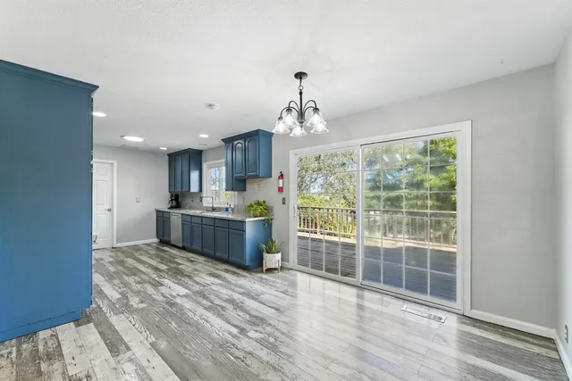 a large kitchen with stainless steel appliances granite countertop a large stove top oven and refrigerator