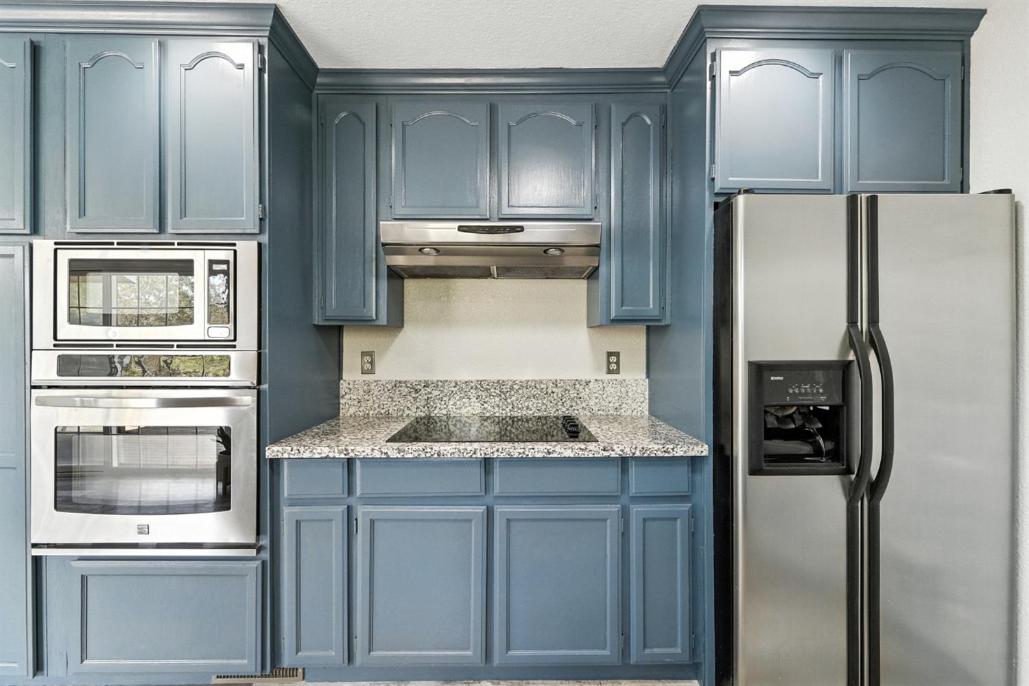 2422 Cheyenne Road Copperopolis, CA 95228 - Photo 18 of 64 a kitchen with stainless steel appliances granite countertop a refrigerator and a stove