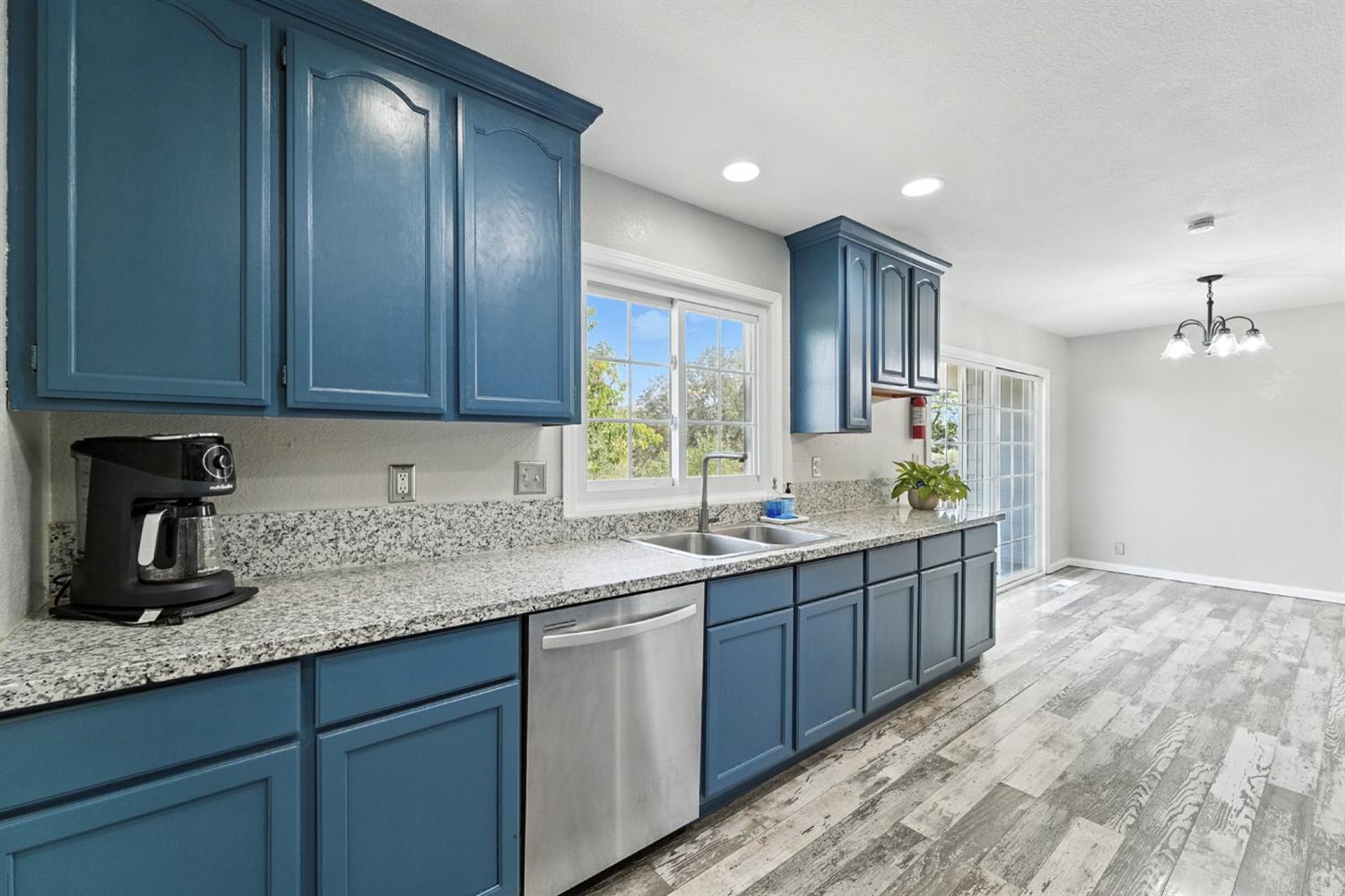 2422 Cheyenne Road Copperopolis, CA 95228 - Photo 19 of 64 a kitchen with granite countertop stainless steel appliances sink microwave and cabinets