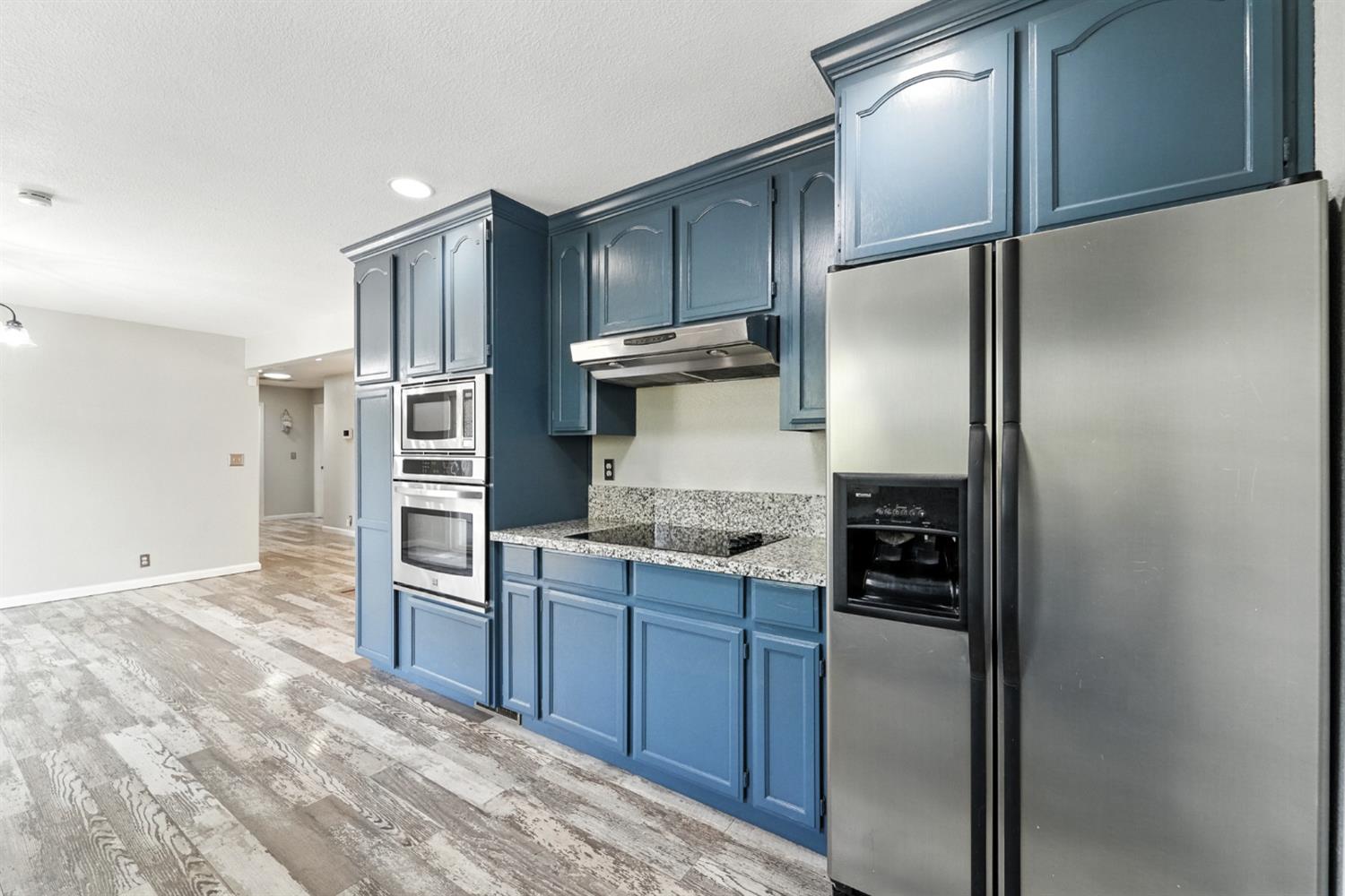 2422 Cheyenne Road Copperopolis, CA 95228 - Photo 20 of 64 a kitchen with stainless steel appliances granite countertop a refrigerator and a sink