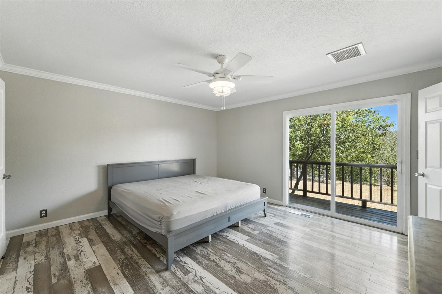 2422 Cheyenne Road Copperopolis, CA 95228 - Photo 25 of 64 a bedroom with a bed and a large window