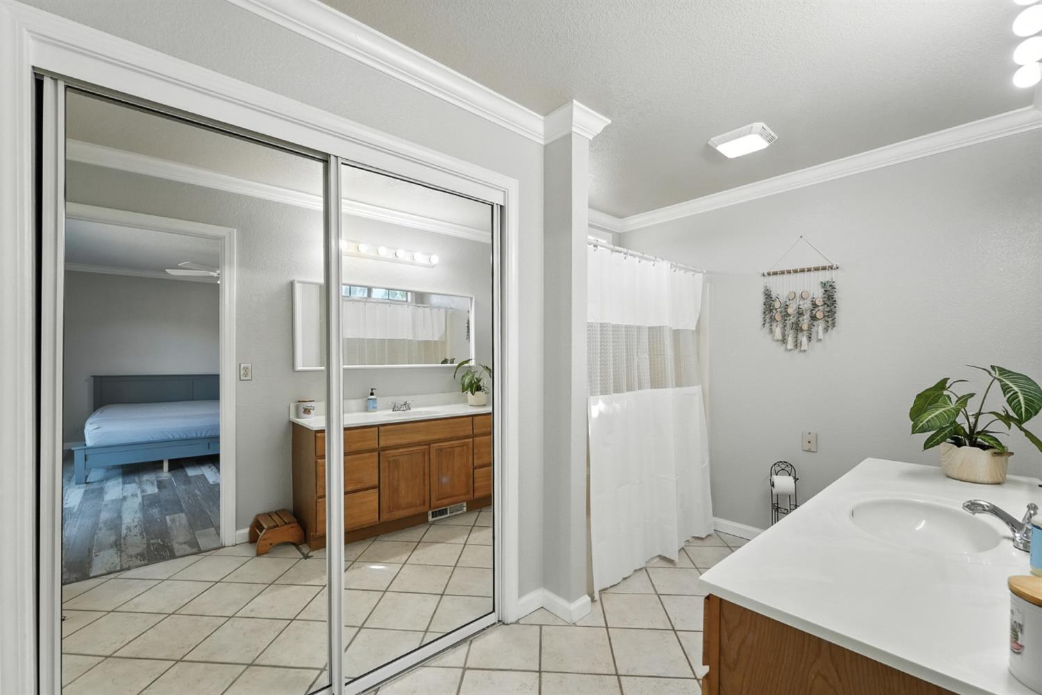 2422 Cheyenne Road Copperopolis, CA 95228 - Photo 28 of 64 a spacious bathroom with a sink and a mirror