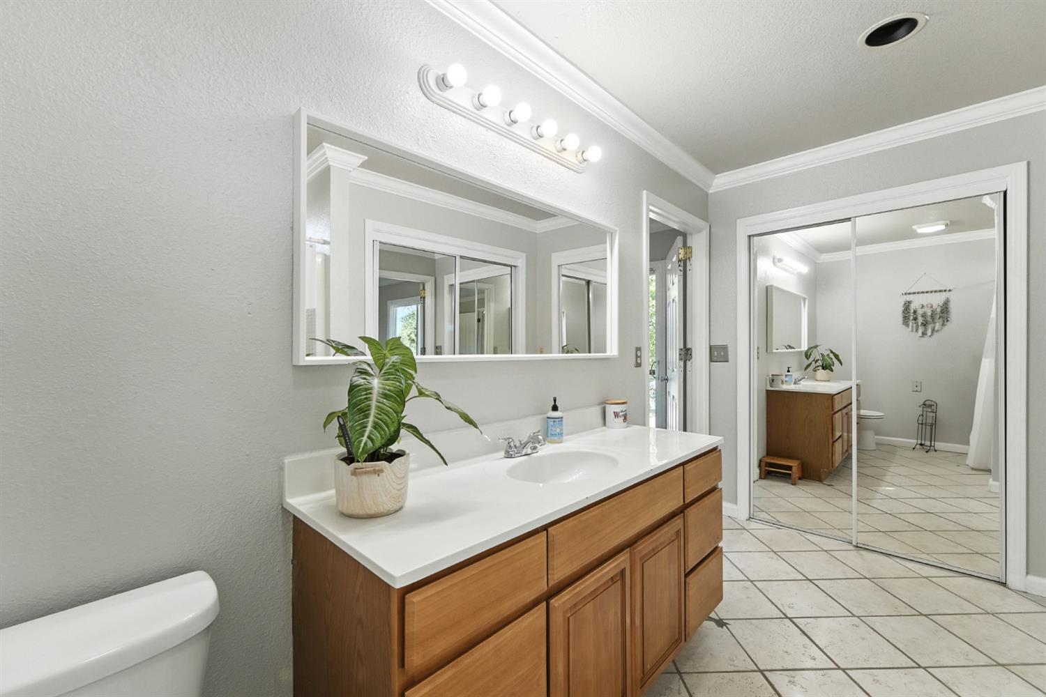 2422 Cheyenne Road Copperopolis, CA 95228 - Photo 30 of 64 a bathroom with a sink and a mirror