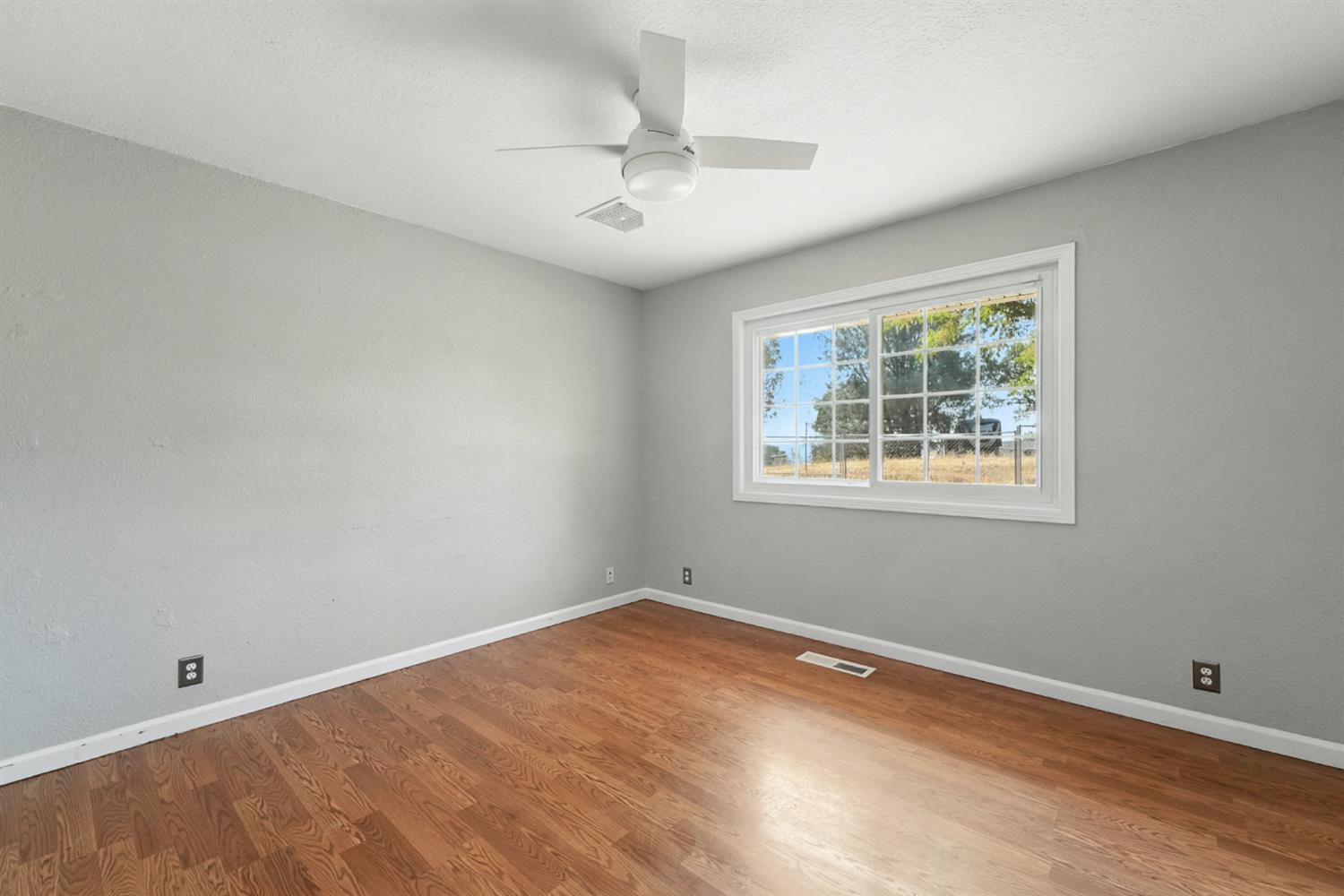 2422 Cheyenne Road Copperopolis, CA 95228 - Photo 32 of 64 wooden floor in an empty room with a window