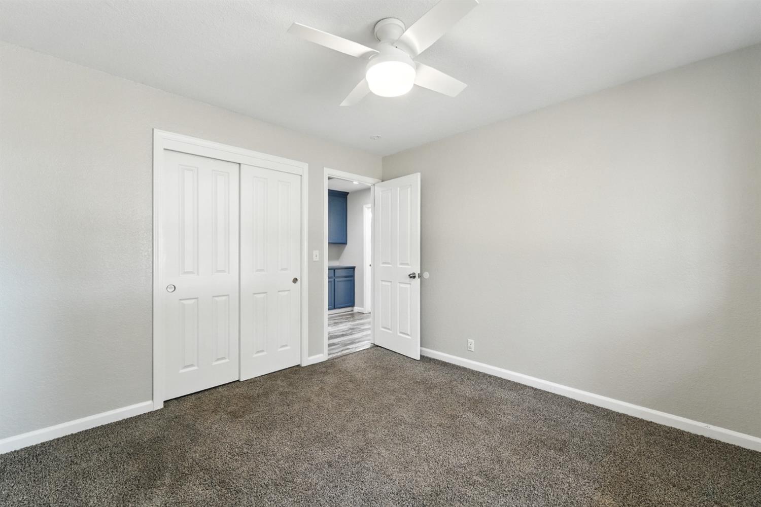 2422 Cheyenne Road Copperopolis, CA 95228 - Photo 35 of 64 an empty room with a ceiling fan and a fan