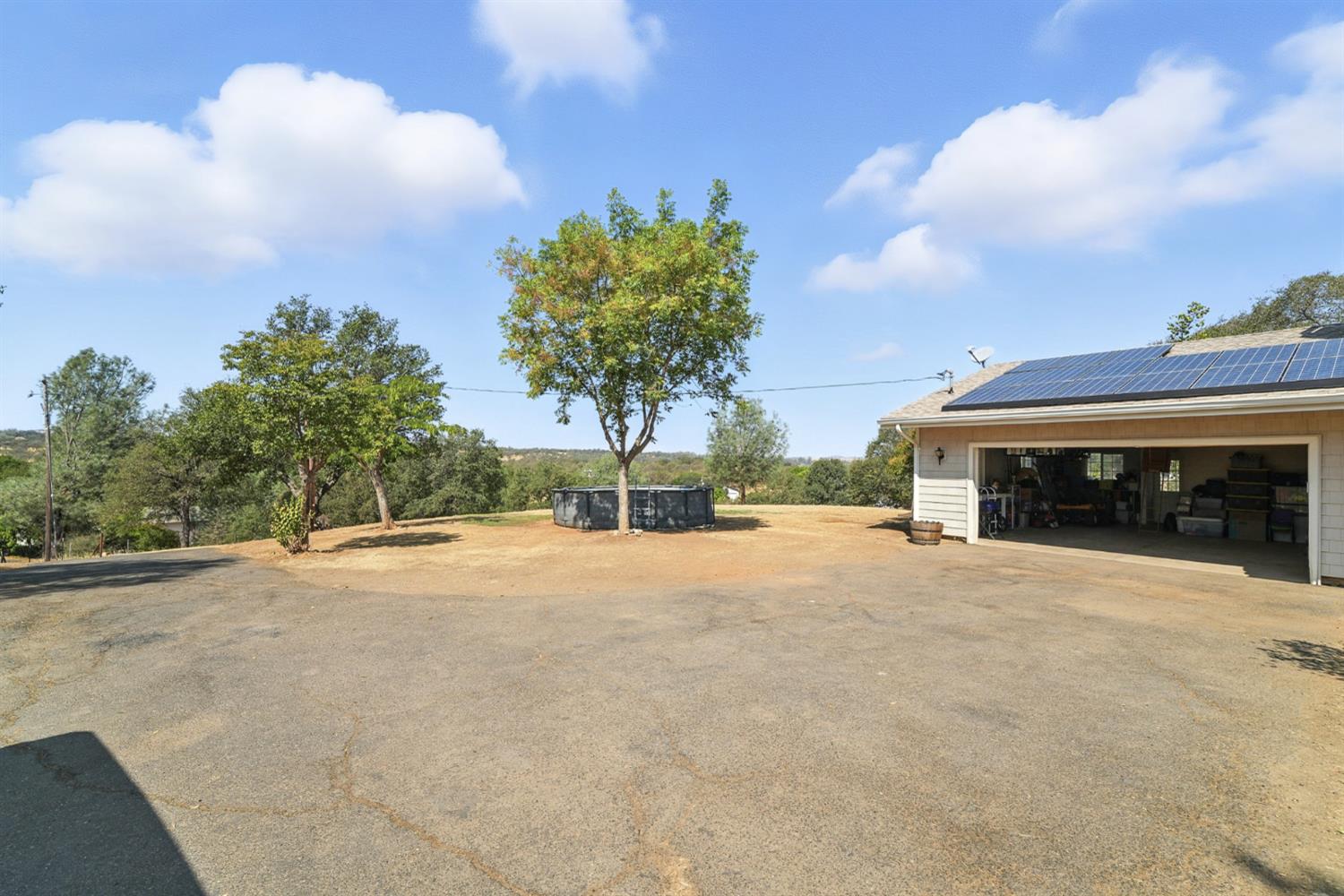 2422 Cheyenne Road Copperopolis, CA 95228 - Photo 40 of 64 a view of a house with a outdoor space and trees