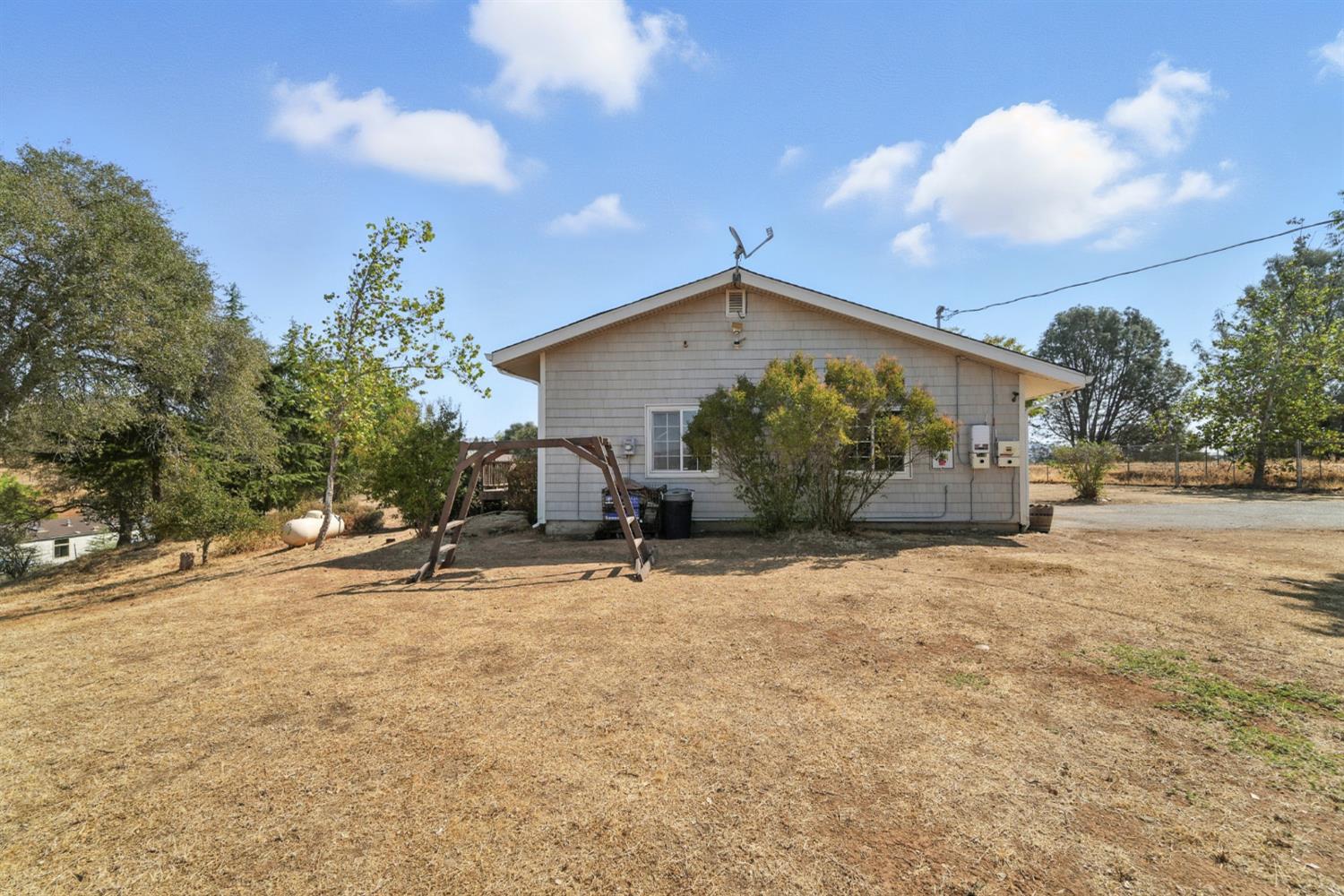 2422 Cheyenne Road Copperopolis, CA 95228 - Photo 42 of 64 a front view of a house with a yard
